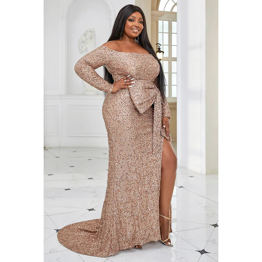 EVENINGS - A stunning, glamorous, romantic long-sleeved off-shoulder gown in warm peach, adorned with sequins, featuring an elegant split and a strategically placed bow for accent. USA Sizes 14-20.