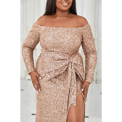 EVENINGS - A stunning, glamorous, romantic long-sleeved off-shoulder gown in warm peach, adorned with sequins, featuring an elegant split and a strategically placed bow for accent. USA Sizes 14-20.