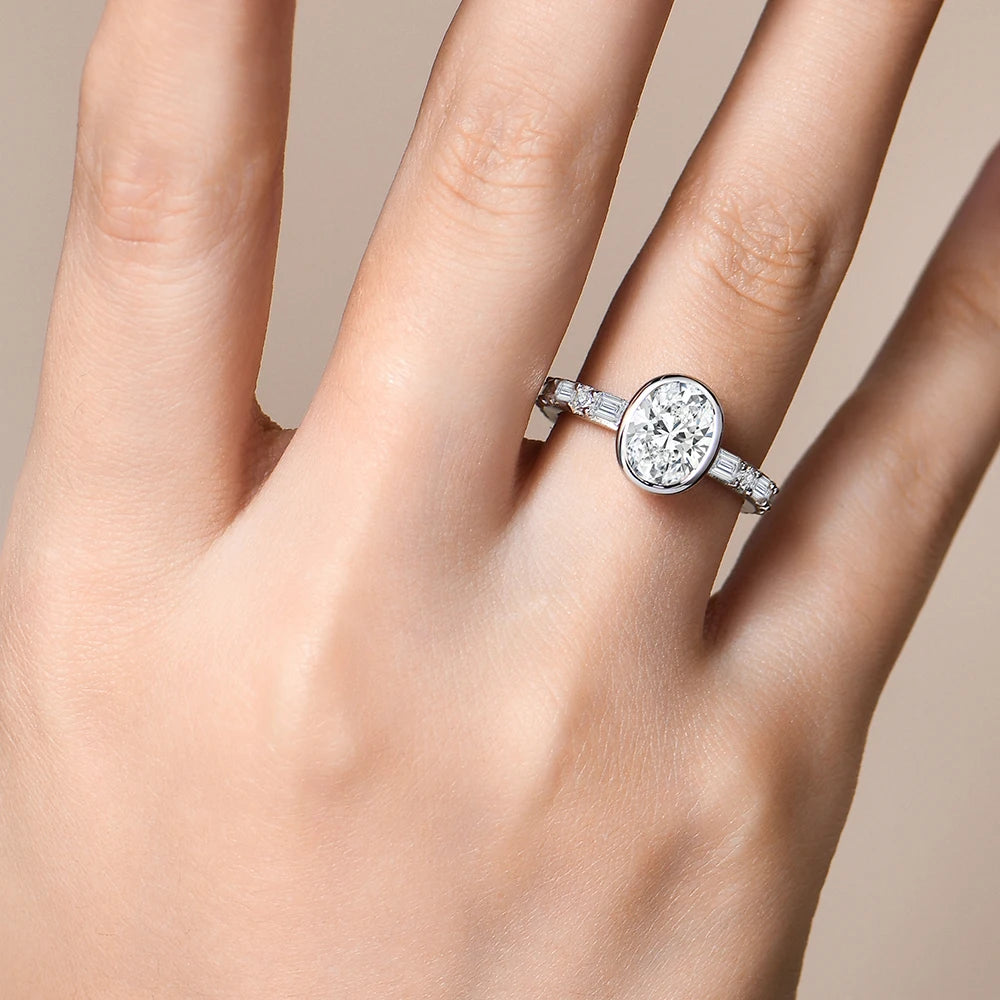 RINGS - Elegant Moissanite Diamond Fashion Rings, crafted in .925 Sterling Silver, are available with either White or Gold plating. Each ring features a dazzling oval-cut 2.0-carat Moissanite diamond stone that radiates sparkle.