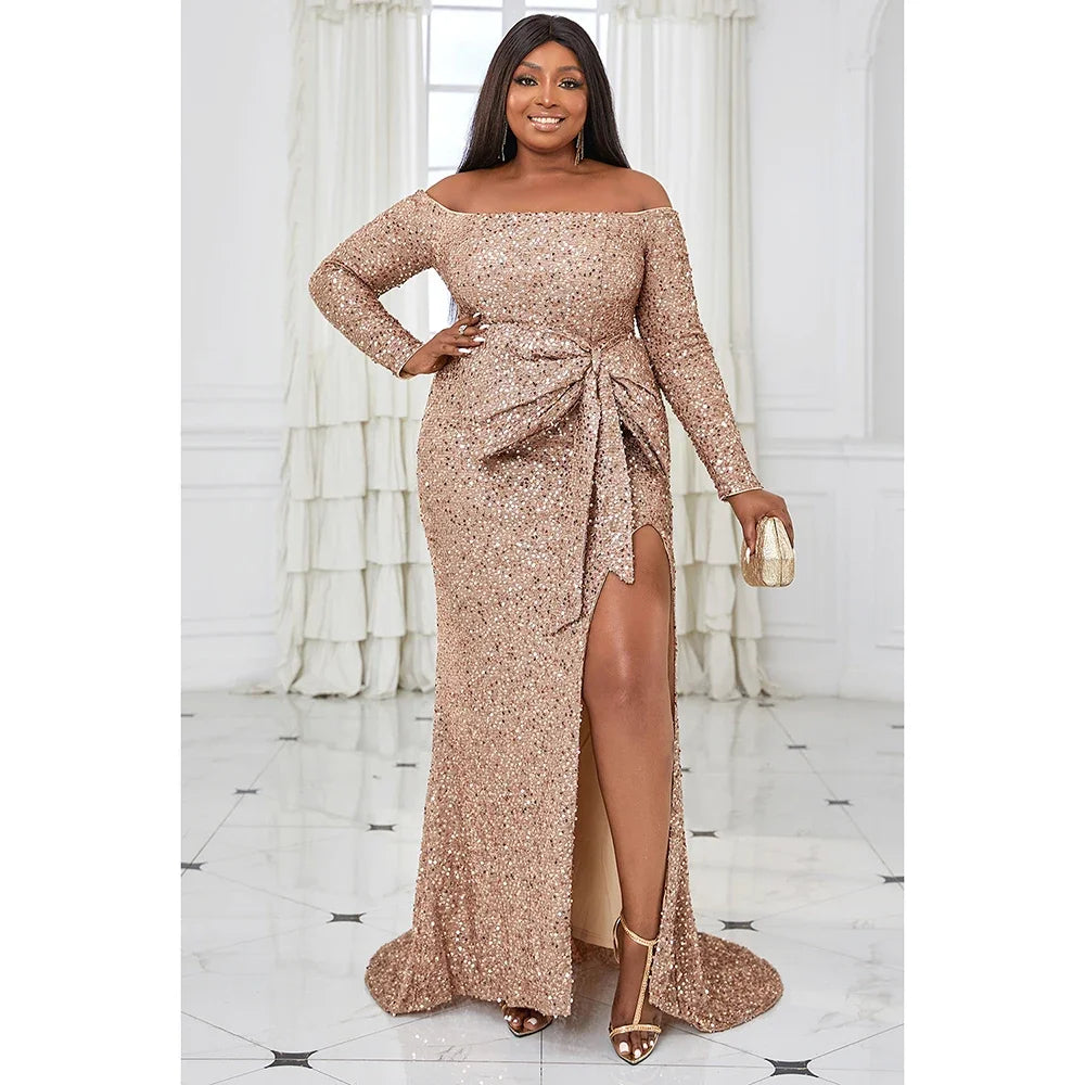 EVENINGS - A stunning, glamorous, romantic long-sleeved off-shoulder gown in warm peach, adorned with sequins, featuring an elegant split and a strategically placed bow for accent. USA Sizes 14-20.